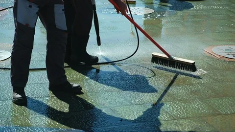Janitor work, cleaning of streets. Cleaning city streets with water hose. Street Vídeos de archivo 110416835