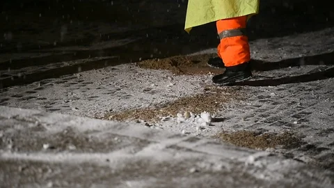 Janitors manually remove fresh snow from the sidewalk during snowfall 스톡 동영상 126972317