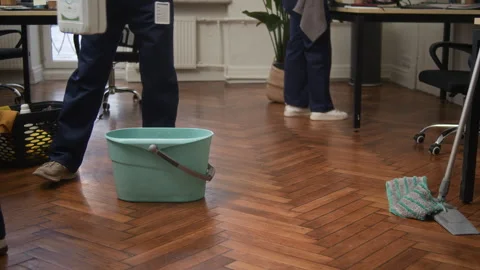Janitors Preparing for Floor Mopping Performing Cleaning Tasks in Office Stock Footage 330449663