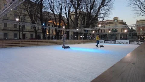 Janitors set up a skating rink before customers enter Stock Footage 296590997