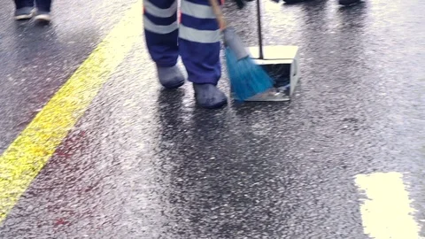 Janitors sweep the garbage on the road Stock Footage 123079717