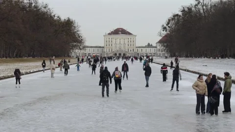 January 5, 2026. Munich, Germany. Crowds of people skating on natural ice at Stock Footage 331008553
