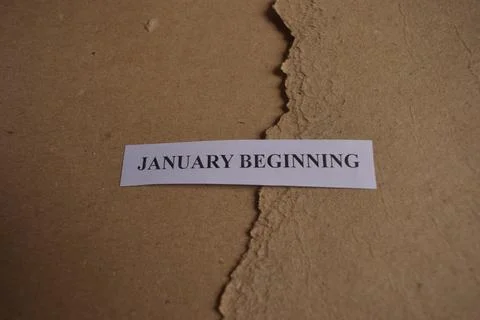 January Beginning message on rustic handmade paper with textured natural ba.. Fotos Stock