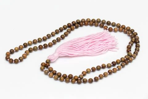 Japa mala  rosary of sandalwood beads 108 Stock Photos