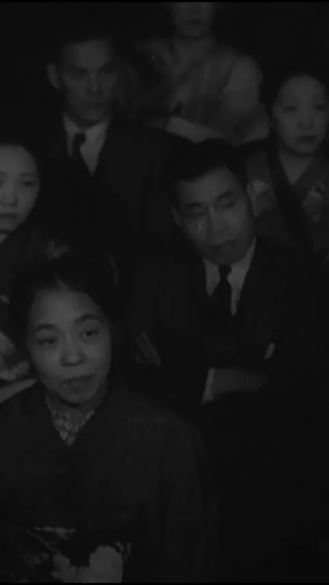 JAPAN - 1939 - Front-facing view of audience members at a show in Japan applaud. Stock Footage 342665507