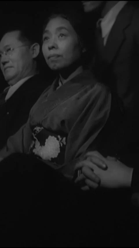 JAPAN - 1939 - Side view of audience members at a show in Japan applaud. Stock Footage 342665528