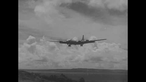 Japan 1940s: A four-engine B-29 Superfortress bomber descends with landing gear Stock Footage 344138019