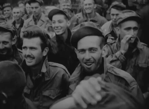 JAPAN - 1945: Camp crowd close-up - Smiling uniformed men face the camera Stock Footage 344509533