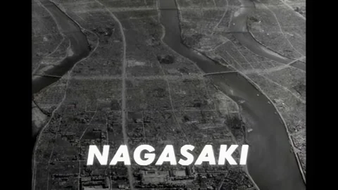 JAPAN - 1945 - Nuclear bomb explodes, forming a mushroom cloud and decimating Stock Footage 340658636