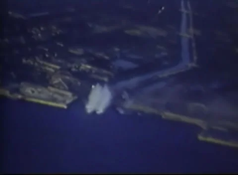 JAPAN - 1945: Shoreline target — structures and a pier at the water's edge Stock-Footage 343119810