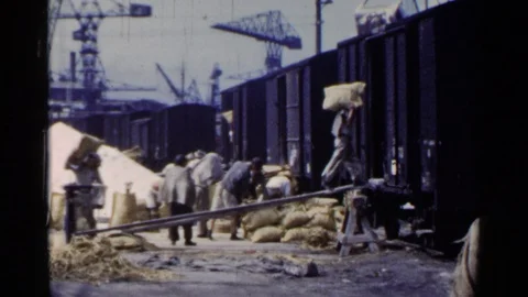 JAPAN-1953: Workers Loading Sacks Of Goods Onto Freight Train Stock Footage 125231274