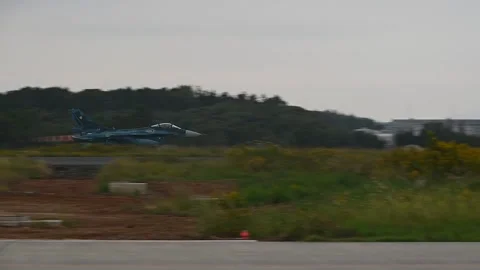 Japan Air Self-Defense Force Mitsubishi F-2 fighter jet taking off with reheat Stock Footage 290335203