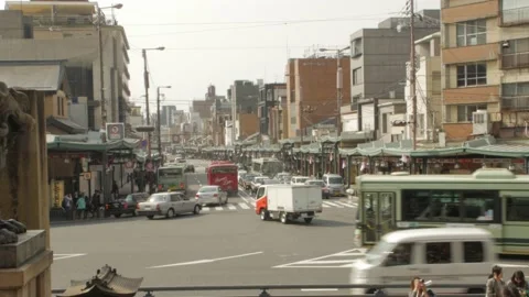 Japan cars crossing turning at intersection crosswalk in afternoon in Kyoto Stock Footage 213792453
