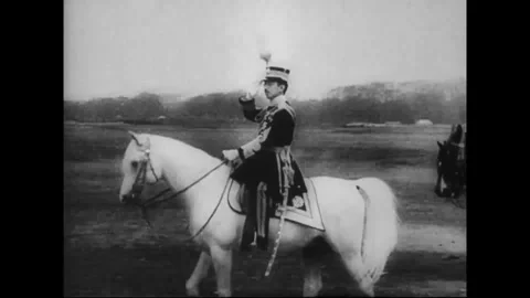 JAPAN - CIRCA 1945: Emperor Hirohito reviews troops on his white horse Stock Footage 339065327