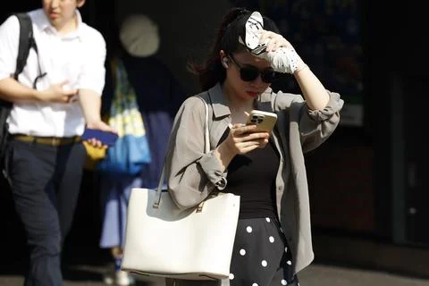 Japan issues heatstroke alerts on second 'brutally' hot day, Tokyo - 22 Jul 2026 Stock Photos