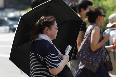Japan issues heatstroke alerts on second 'brutally' hot day, Tokyo - 22 Jul 2026 Stock Photos
