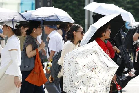 Japan issues heatstroke alerts on second 'brutally' hot day, Tokyo - 22 Jul 2026 Stock Photos