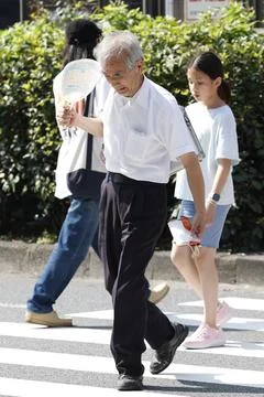 Japan issues heatstroke alerts on second 'brutally' hot day, Tokyo - 22 Jul 2026 Stock Photos