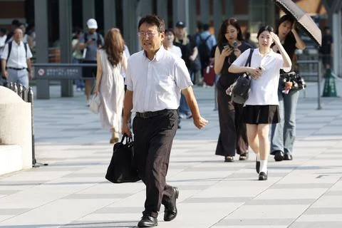 Japan issues heatstroke alerts on second 'brutally' hot day, Tokyo - 22 Jul 2026 Stock Photos