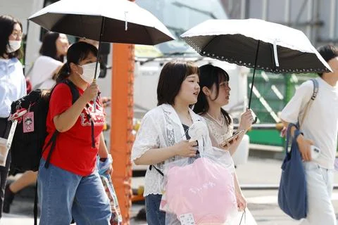 Japan issues heatstroke alerts on second 'brutally' hot day, Tokyo - 22 Jul 2026 Stock Photos