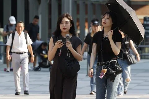 Japan issues heatstroke alerts on second 'brutally' hot day, Tokyo - 22 Jul 2026 Stock Photos