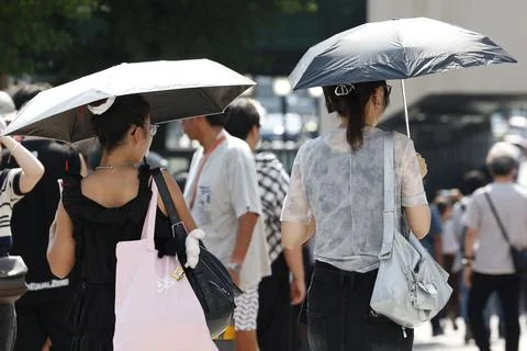 Japan issues heatstroke alerts on second 'brutally' hot day, Tokyo - 22 Jul 2026 Stock Photos