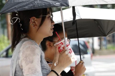 Japan issues heatstroke alerts on second 'brutally' hot day, Tokyo - 22 Jul 2026 Stock Photos