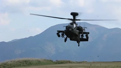 Japan Self-Defense Force AH-64DJP Apache helicopter landing on grass track Vídeos de archivo 255284573