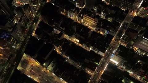 Japan Tokyo Aerial v50 Birdseye view flying low over Ginza area panning night Stock Footage