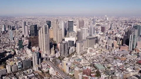 Japan Tokyo Aerial v91 Flying near Shinjuku panning with cityscape views Stock Footage