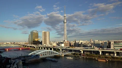 Japan, Tokyo, modern city architecture, traffic and the Sumida River Stock Footage