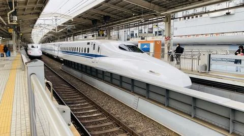 Japan train at station platform Stock Photos