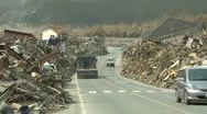 Japan Tsunami Aftermath - Debris Piled Along Side Of Road Stock Footage