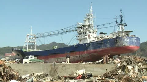 Japan Tsunami Aftermath - Large Ship Lies Amidst Burnt Wasteland Stock Footage