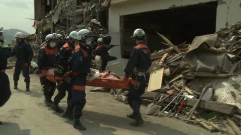 Japan Tsunami Aftermath - Rescue Team Attend To Dead Body In Rikuzentakata City Stock Footage