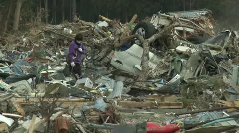Japan Tsunami Aftermath - Survivors Walk Through Destroyed Downtown Stock Footage