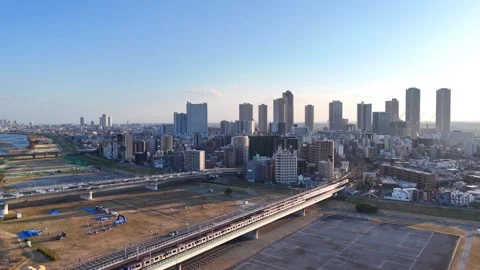 Japan Urban Infrastructure | Train Crossing Bridge - 4K Aerial Video Stock-Footage 329429366
