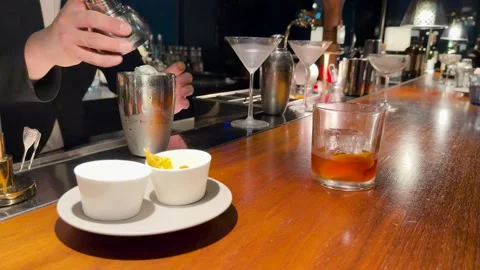 Japanese Bartender in Black Suit Preparing Cocktails at Wooden Bar Stock Footage 334987453