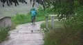 Japanese Bike Rider On Green Forest Path On Rainy Day 02 4K 4k or 4k+ Resolution