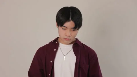 Japanese boy feels disappointed to keep his mask on. Stock Footage 220757211