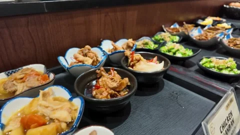 Japanese Buffet Selection with Pork Belly Stew and Side Dishes Stock-Footage 340244329
