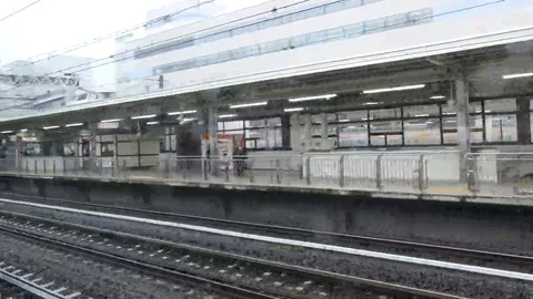 Japanese bullet train, as seen from the inside of of another bullet train Stock Footage 69076531