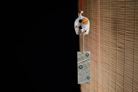 Japanese cat bell on window Stock Photos