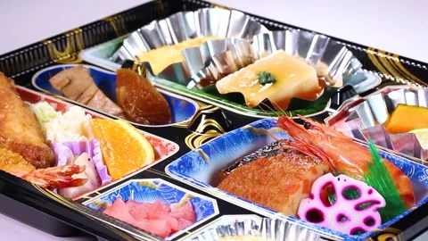 Japanese catered lunch box close up rotating Stock Footage 320809207