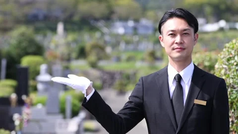 Japanese Cemetery Staff Guiding Visitors at Memorial Park Stock-Footage 344123101