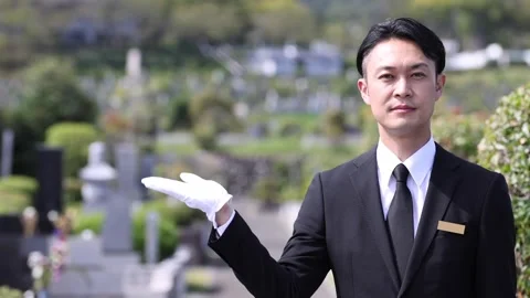 Japanese Cemetery Staff Guiding Visitors at Memorial Park Stock-Footage 344123110
