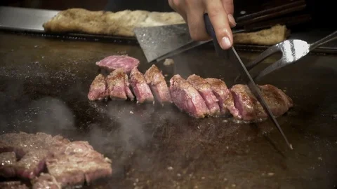 Japanese chef grilled the beef while cooked and sliced on hot Pan. Stock Footage 84922150