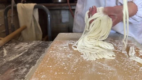 Japanese Chef Lifting and Separating Freshly Cut Handmade Udon Noodles, Japan Stock Footage 343189494