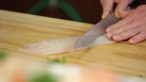 Japanese chef makes sashimi to make sushi Stock Footage 144513043