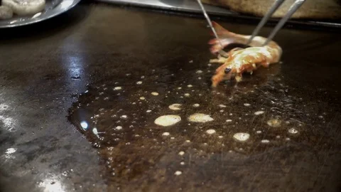 Japanese chef preparing cooking with fried shrimp and cut of Stock Footage 84885526